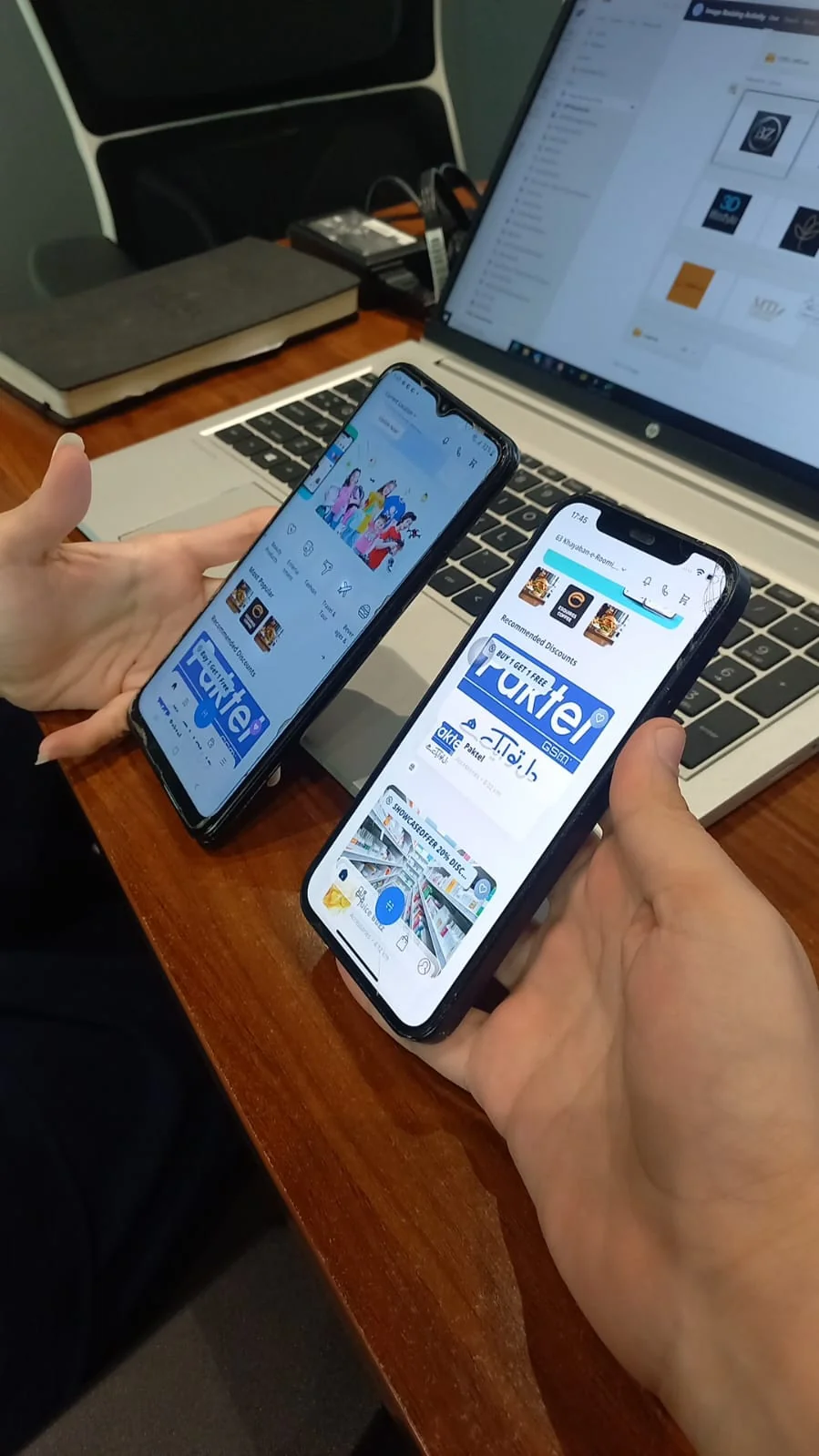 Golootlo usability testing: participant comparing the app on two phones