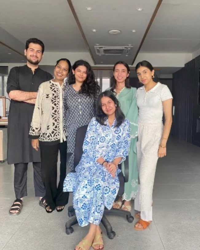 Behind the scenes: the team posing together in the office